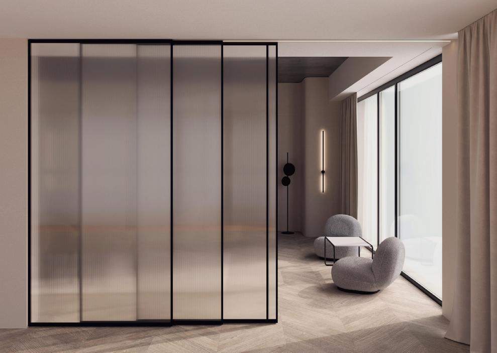 Slim-frame sliding glass partition between living room and study