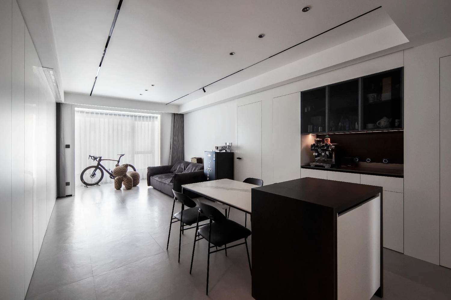 Open kitchen and dining room in white with black accents